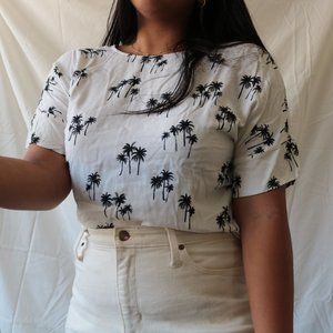 white blouse with black palm tree print